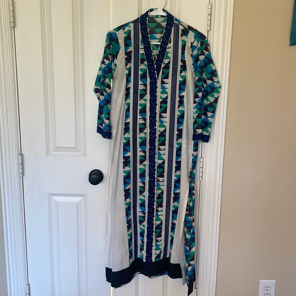 Khaadi Pakistani Indian kurta with stripes of printed cloth and embroidery.